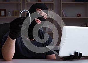Hacker hacking computer late at night