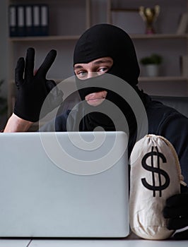 Hacker hacking computer late at night