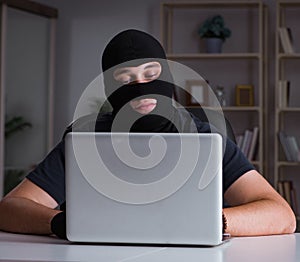 Hacker hacking computer late at night