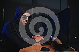 Hacker is hacking into the computer network. Computer criminal