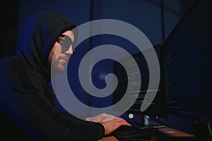 Hacker is hacking into the computer network. Computer criminal