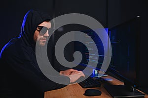 Hacker is hacking into the computer network. Computer criminal