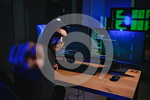 Hacker is hacking into the computer network. Computer criminal
