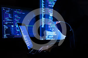 Hacker hacking computer password at night
