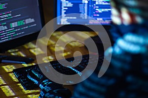 Hacker hacking computer password at night