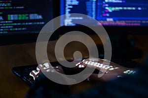 Hacker hacking computer password at night