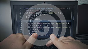 Hacker hands code typing while coding on a laptop pc
