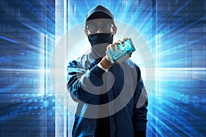 Hacker holding mobile phone