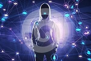 Hacker in hoodie with connected digital people team icons on dark blurry purple office interior background. Digital network,