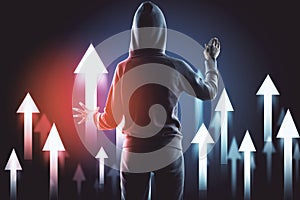 Hacker in hoodie using abstract digital arrow