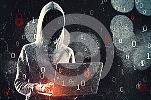 Hacker in hoodie using laptop while standing on abstract hacking background with bokeh circles and binary coding. Malware and