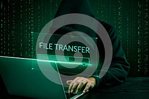 Hacker initiating file-transfer with binary code background.