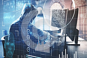 Hacker with  laptop and digital business interface