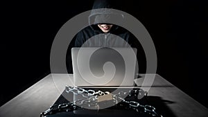 Hacker with locked laptop computer. Cyber attack concept