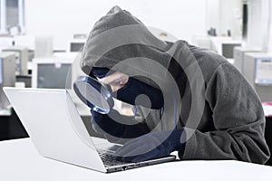 Hacker looking for information at office