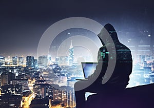 Hacker man with anonymous mask using laptop to hacking in the top building AI Generative photo
