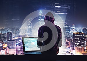 Hacker man with anonymous mask using laptop to hacking in the top building AI Generative photo