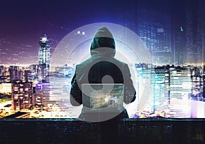 Hacker man with anonymous mask using laptop to hacking in the top building AI Generative photo