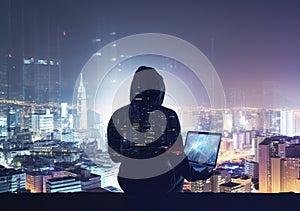 Hacker man with anonymous mask using laptop to hacking in the top building AI Generative photo