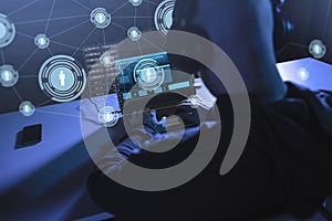 Hacker with network using laptop computer