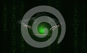 hacker over a screen green binary code. Crime and Information Theft and Computers