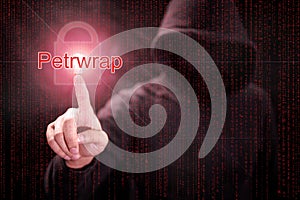 Hacker pointing Petrwrap ransomware cyber attack