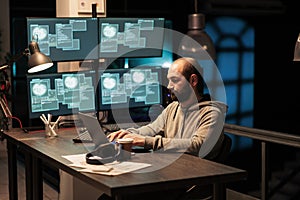 Hacker programmer hacking system at office