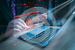 Hacker or programmer using laptop with triangle caution warning sign, coding, cryptography, hacker, crime, virus, for notification