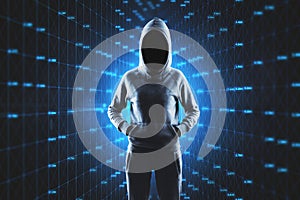 Hacker standing on abstract glowing blue cyber big data background. Technology and innovation concept