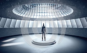 Hacker standing in futuristic hall interior
