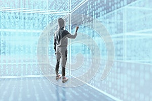 Hacker standing in glowing cyber binary code room. Technology concept