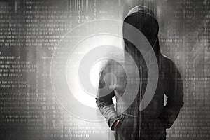 Hacker standing over on binary code