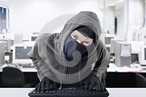Hacker stealing business data at office