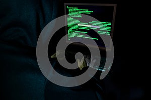 Hacker stealing data from a computer.