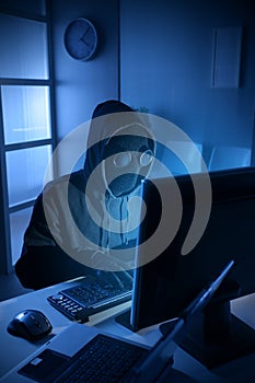 Hacker stealing data from computer