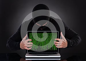 Hacker stealing data of a laptop computer