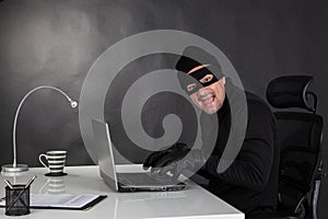 Hacker stealing data and laughing