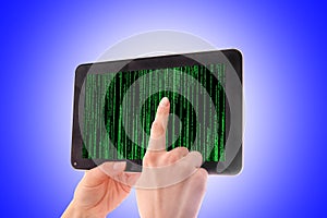 Hacker with tablet in hands and binary code