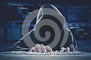 Hacker typing on keyboard with coding background