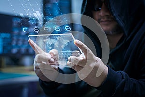 Hacker using clear tablet with HUD panel and code graph bar data