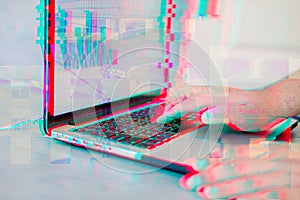 Hacker using computer and code graph bar data analytsis element for cyber technology concept with glitch