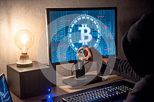 Hacker using computer for digital currency laundering