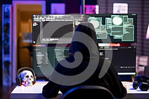 Hacker using exploits on computer to break into systems