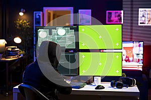 Hacker using exploits on green screen computer to break into systems