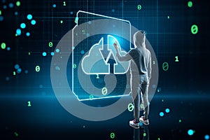 Hacker using glowing cloud computing circuit hologram on  background. Data storage, hacking and technology concept