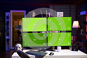 Hacker using green screen PC, coding malware designed to exploit backdoors
