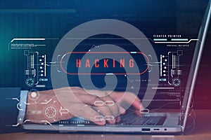 Hacker using a laptop with binary code digital interface. Dangerous hack breaks into data servers and infects their system with a