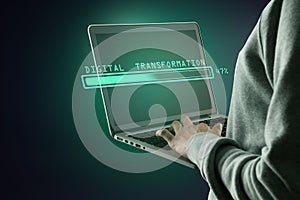 Hacker using laptop computer with abstract glowing loading bar on gray dark background. Digital transformation, hacking, internet