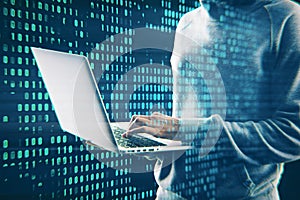 Hacker using laptop with creative digital binary code dots hologram. Digital data hacking concept.