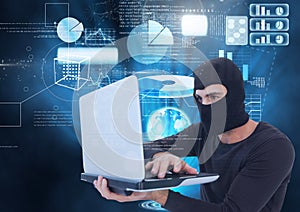 Hacker using a laptop in front of digital background